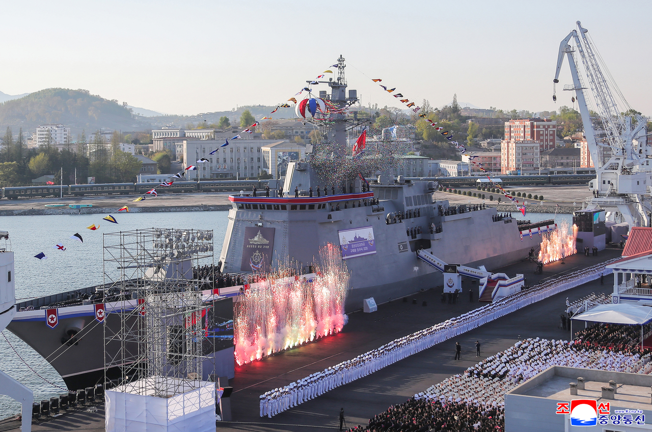 The Choe Hyon is seen docked amid confetti, troops, and military fanfare during its official unveiling ceremony in Nampho on Friday. (Yonhap)