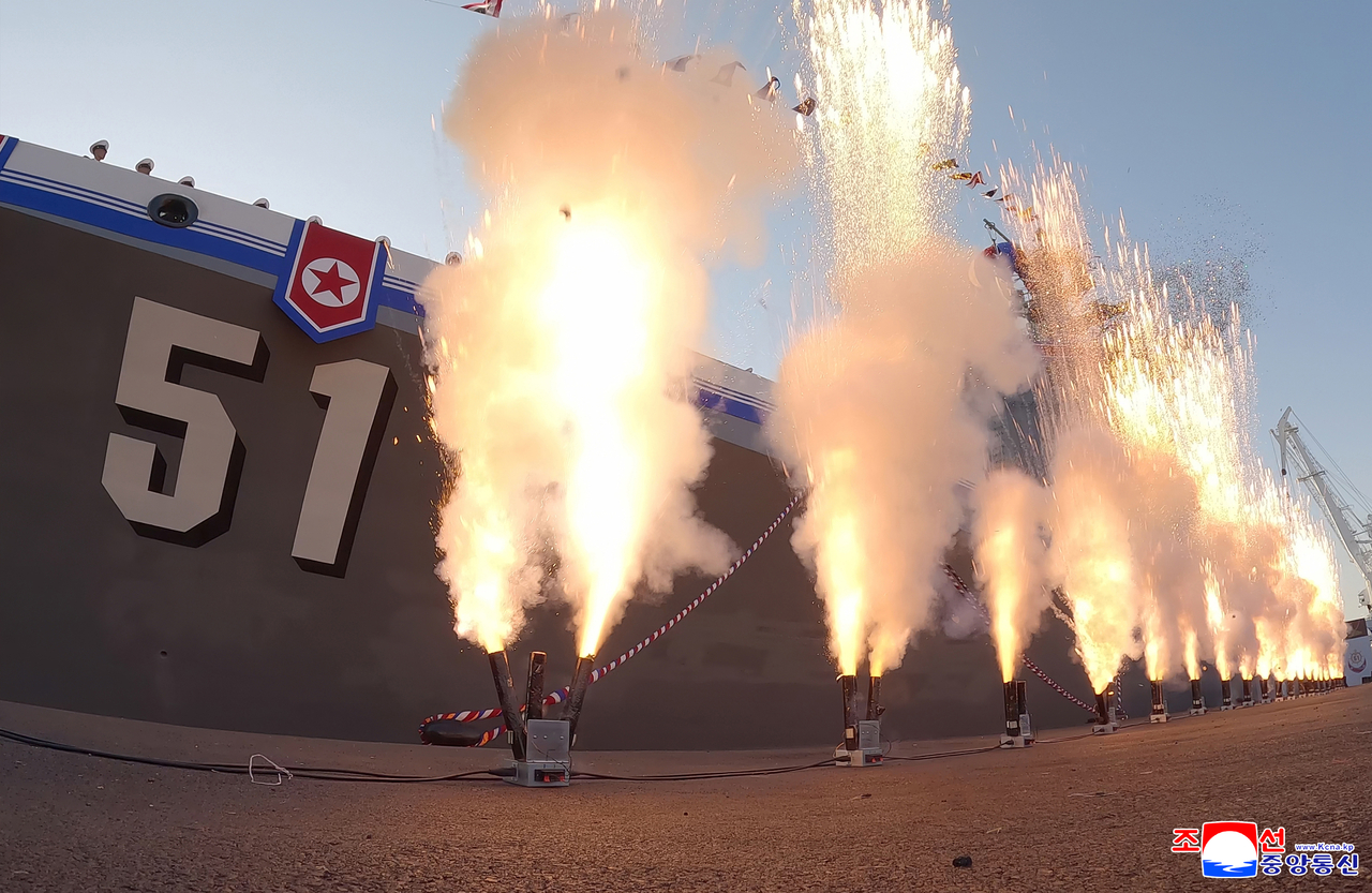 Fireworks erupt next to the destroyer’s hull marked “51” as part of celebrations marking the launch of the 5,000-ton warship on Friday. (Yonhap)