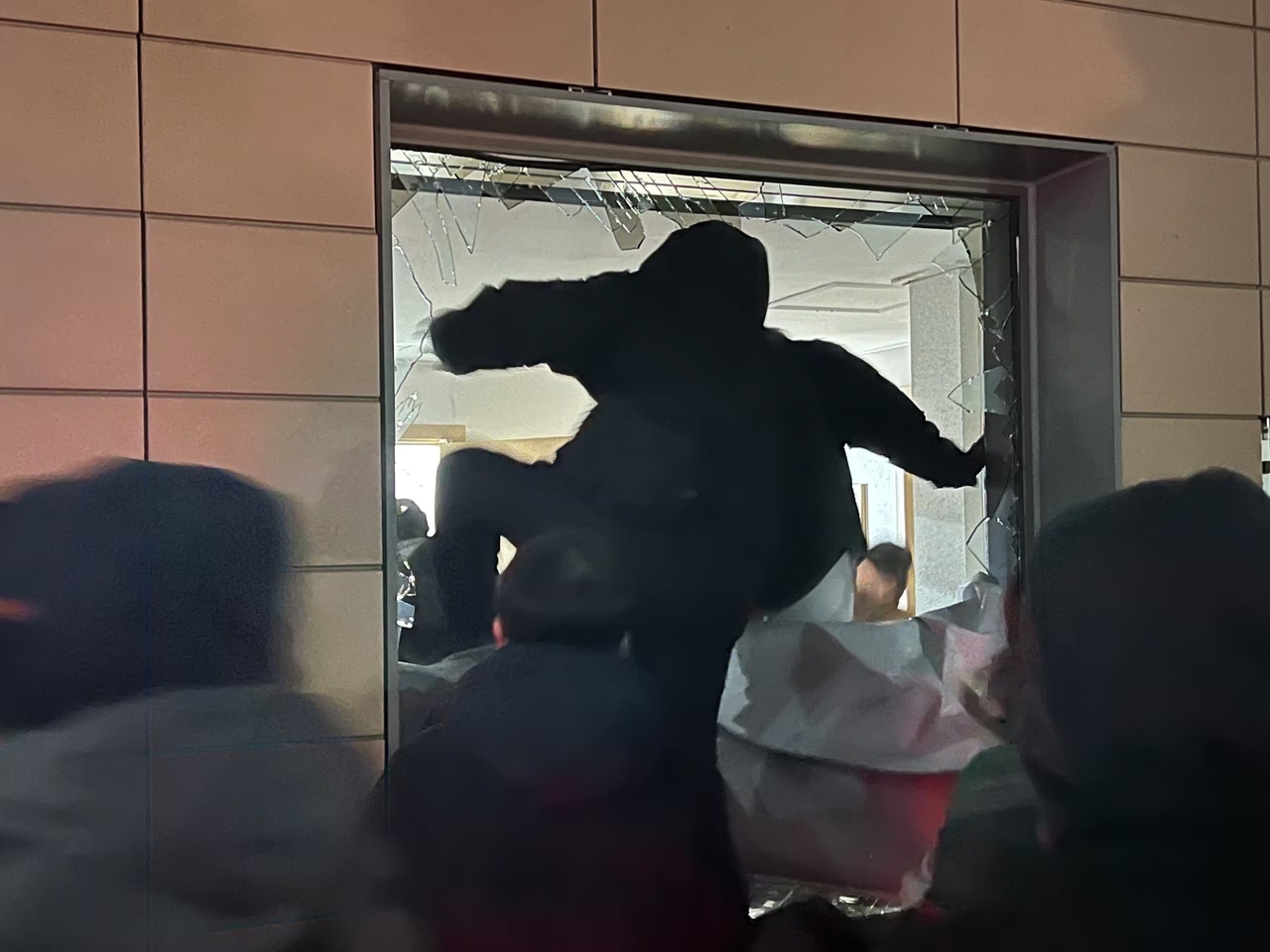 Supporters of former President Yoon Suk Yeol storm the Seoul Western District Court through a shattered window on Jan. 19 after an arrest warrant was issued for Yoon, as YouTubers livestreamed the riot in real time. (X)