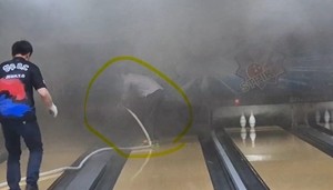 Off-duty firefighter contains flames at bowling alley