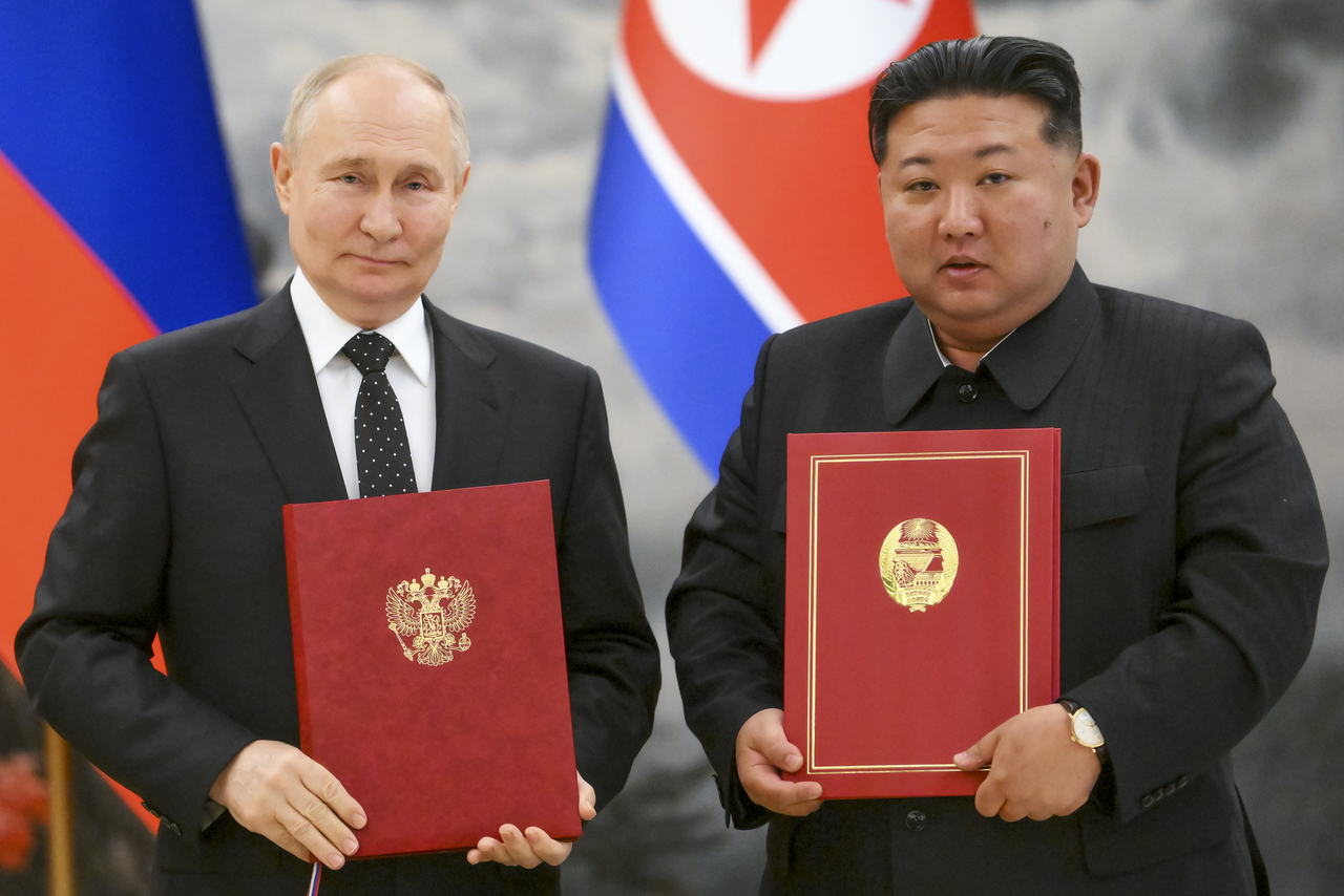 Russian President Vladimir Putin (left) and North Korea's leader Kim Jong Un pose for a photo during a signing ceremony of a new partnership in Pyongyang, North Korea, June 19, 2024. (Pool Photo via AP)