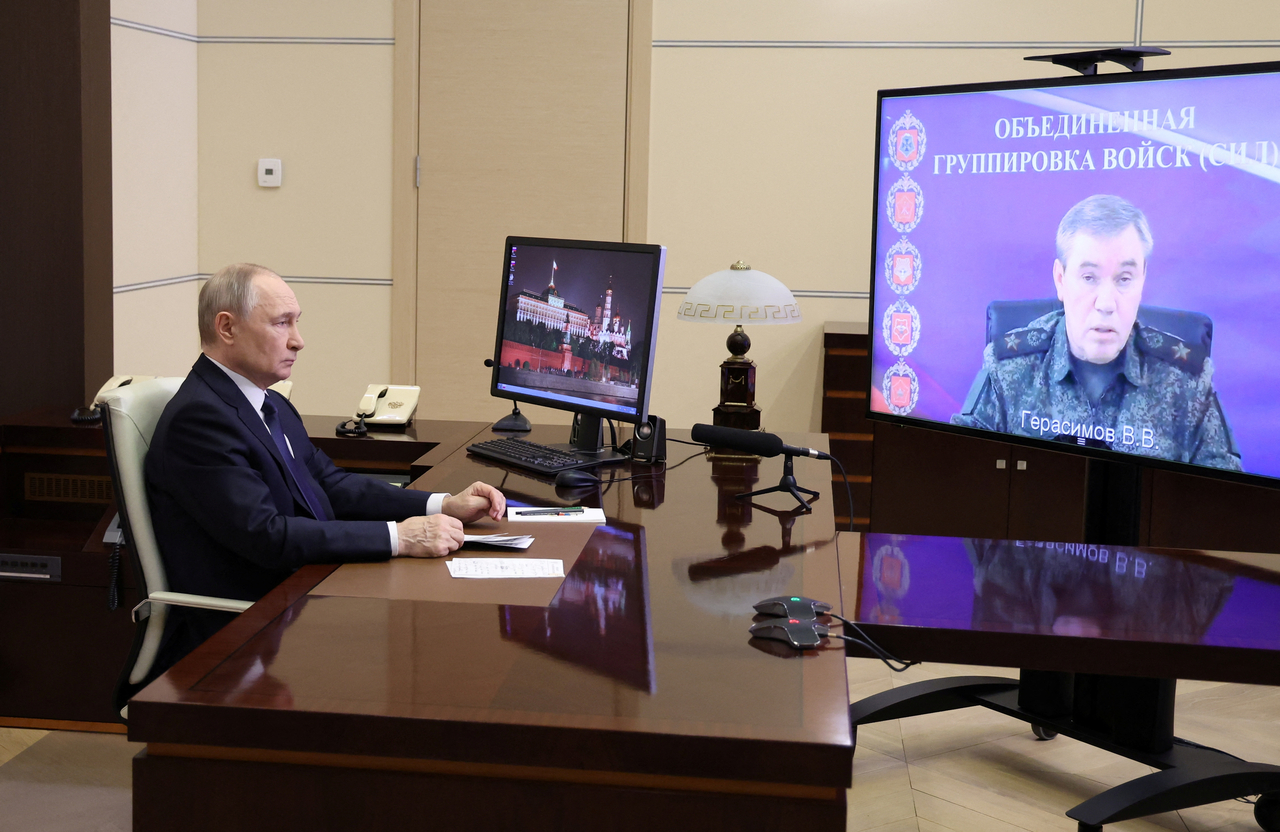 Russian President Vladimir Putin listens to a report of Chief of the General Staff of Russian Armed Forces Valery Gerasimov via video link at the Novo-Ogaryovo state residence outside Moscow, Russia, April 26. (Kremlin Pool via Reuters)