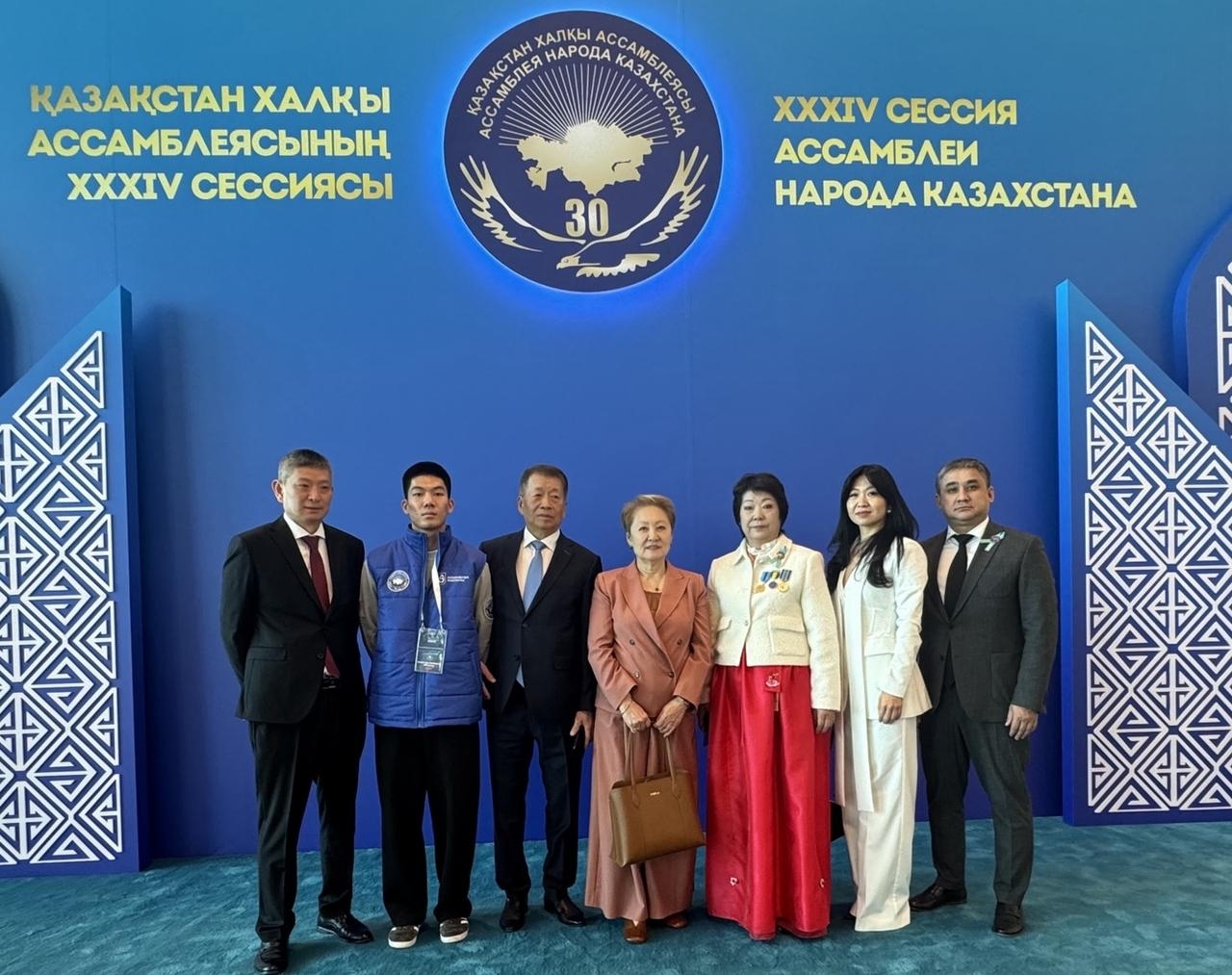 Attendees  pose for a group photo ahead  of the 34th session of the Assembly of the People of Kazakhstan at Palace of Independence in Astana, the capital city of Kazakhstan on Thursday (From the right)  Yuri Shek, Chairman of the Association of Koreans of the Aktobe Region; Natalia Lee, Chief Ballet Master of the State Republican Academic Korean Theater; Lyudmila Lee, Chairperson of the Ethnocultural Association of Koreans of the Atyrau Region; Lyubov Ni, Artistic Director of the State Republican Academic Korean Theater; Roman Kim, Member of the Board of Trustees of the Association of Koreans of Kazakhstan; Denis Kim, Volunteer of the Assembly of the People of Kazakhstan; Konstantin Kim, Editor-in-Chief of the newspaper Koryo Ilbo. (Sanjay Kumar/ The Korea Herald)