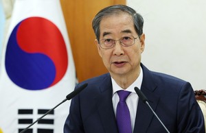 Han Duck-soo resigns ‘to take on bigger responsibility’