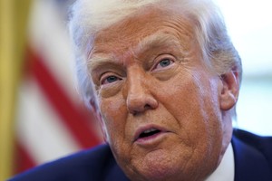 Trump signals US will make defense cost-sharing part of talks for 'package' deal on trade, other issues